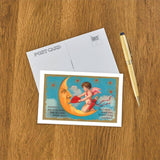 Postcard: Cupid Feeding Heart to Moon