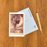 Postcard: Two Men & a Paper Moon